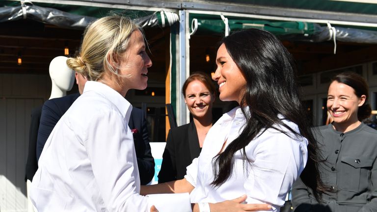 The Duchess of Sussex (right) hugs designer Misha Nonoo at the launch the Smart Works capsule collection at John Lewis in Oxford Street, London.