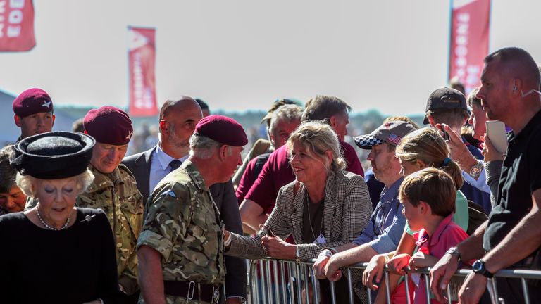 Prince Charles stops to talk with visitors at a commemorative service and wreath-laying with Princess Beatrix of The Netherlands at Ginkel Heath on Ginkel Heath near Ede . The Prince is Colonel-in-Chief of The Parachute Regiment and The Army Air Corps. 1500 paratroopers from Great Britain, USA, The Netherlands and Poland are parachuting onto the Heath as part of the Operation Market Garden 75th anniversary commemorations near Arnhem, Netherlands.