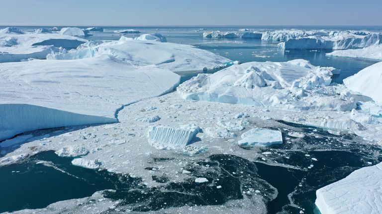 ILULISSAT, GREENLAND - AUGUST 04: In this aerial view icebergs float at the mouth of the Ilulissat Icefjord during a week of unseasonably warm weather on August 4, 2019 near Ilulissat, Greenland. The Sahara heat wave that recently sent temperatures to record levels in parts of Europe has also reached Greenland. Climate change is having a profound effect in Greenland, where over the last several decades summers have become longer and the rate that glaciers and the Greenland ice cap are retreating has accelerated.   (Photo by Sean Gallup/Getty Images)