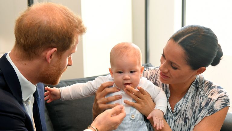 The Duke and Duchess of Sussex holding their son Archie during a meeting with Archbishop Desmond Tutu and Mrs Tutu at their legacy foundation in cape Town, on day three of their tour of Africa.