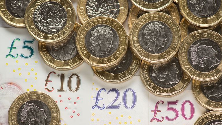 EMBARGOED TO 0001 MONDAY JULY 29 File photo dated 26/01/18 of bank notes and coins. The national living wage has helped increase the pay of self-employed workers even though they are not entitled to receive it, a new study suggests.