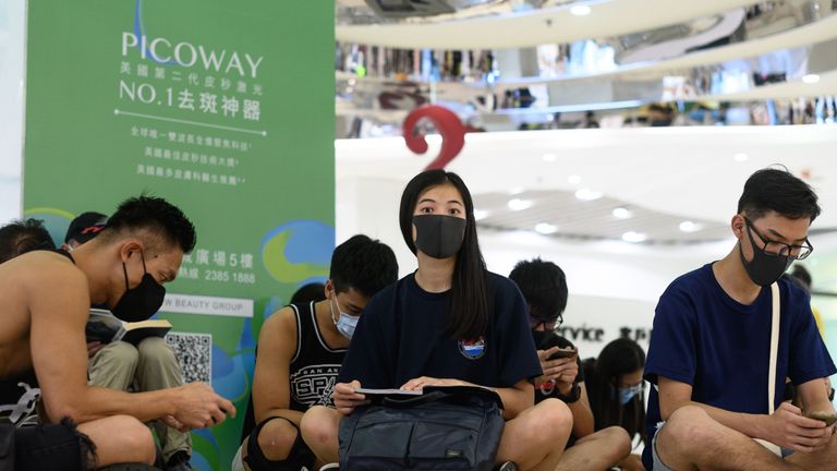 Protesters attend a silent rally inside a shopping mall in Sha Tin district in Hong Kong