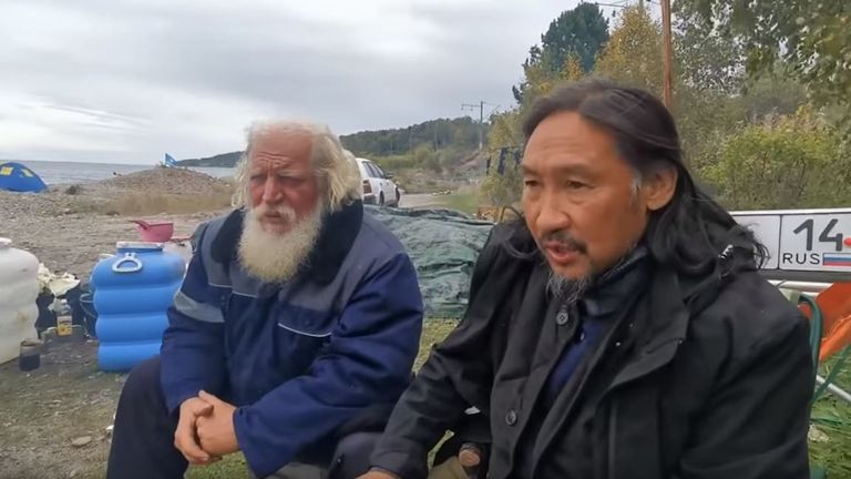 The shaman (right) had been camping near Lake Baikal with his followers. Pic: YouTube/ Aleksandr Gabyshev