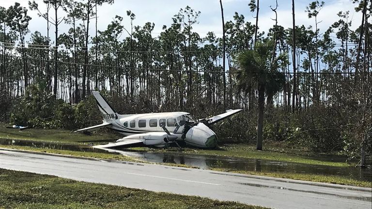 A smashed plane was part of the debris left by Hurricane Dorian at Grand Bahama International Airport