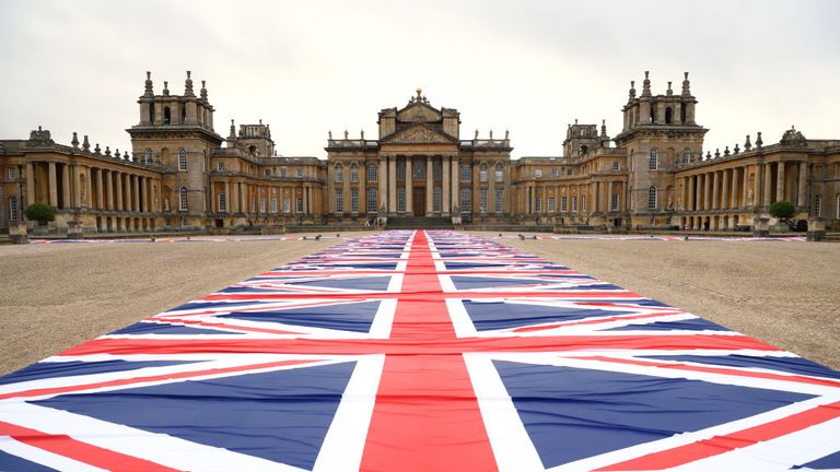 A giant walkway of flags created by artist Maurizio Cattelan is part of the exhibition at Blenheim Palace