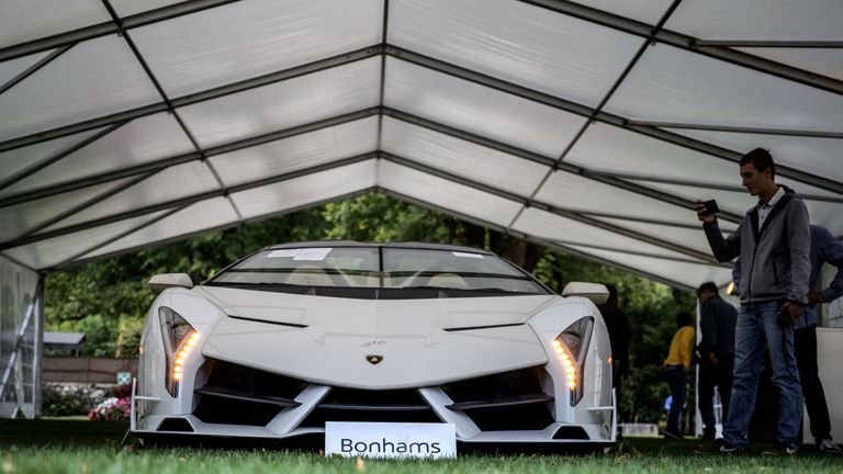 A picture taken on September 28, 2019 at the Bonmont Abbey in Cheserex, western Switzerland shows a 2014 Lamborghini Veneto Roadster model car during an auction preview by sales house Bonhams of sport cars belonging to the son of the Equatorial Guinea&#39;s President