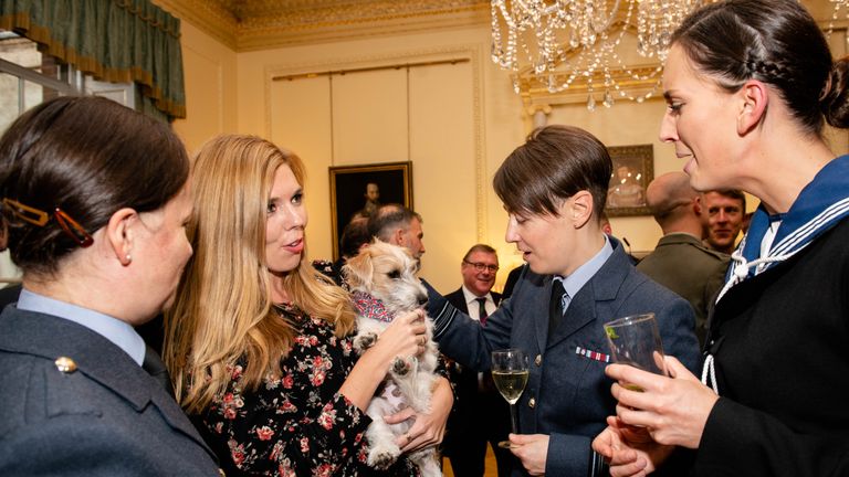 Carrie Symonds with Dilyn the dog at a military reception in Downing Street