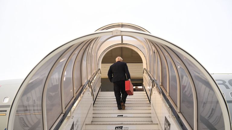 Boris Johnson boards his plane at Heathrow Airport as he heads off for the annual UN General Assembly in New York