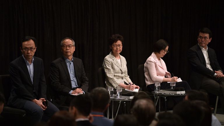 Hong Kong Chief Executive Carrie Lam (C) and a group of government officials took part in a town hall meeting