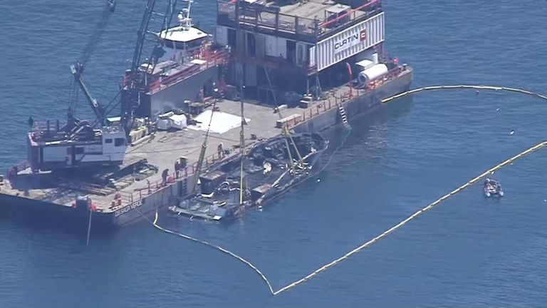 Salvage crews raised a dive boat which caught fire and sank off the California coast, killing 34 people.
