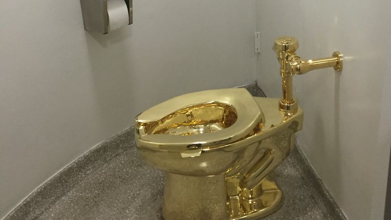 A fully functioning solid gold toilet, pictured here during a previous installation, is thought to have been targeted by thieves