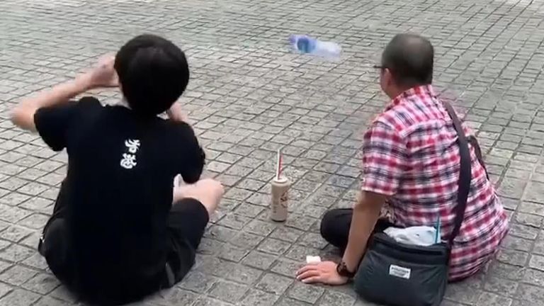 Bottle flip sends protesters into celebrations.