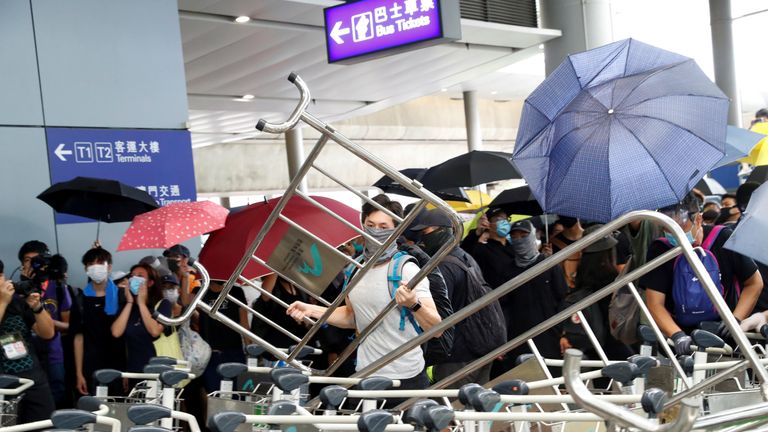 Protesters building barricades outside Hong Kong International Airport