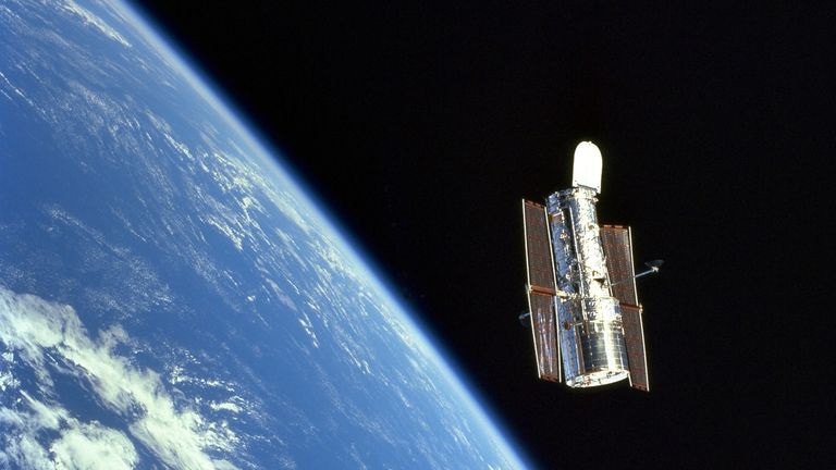 Scientists used data from the Hubble space telescope, seen here floating above the Earth. Pic: NASA/ESA