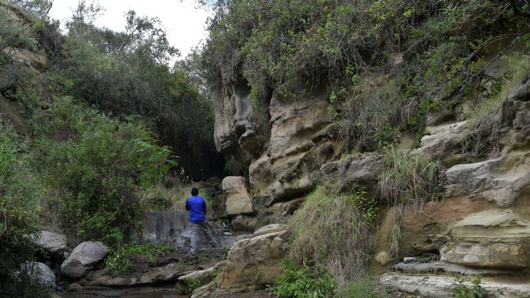 A man stands a section of the gorge at Hell's Gate National Park