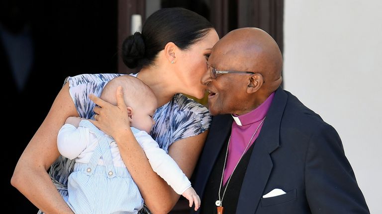 Meghan, Duchess of Sussex, holding her son Archie, meets Archbishop Desmond Tutu 