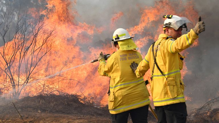 New South Wales Rural Fire Service firefighters are seen fighting fires on Long Gully Road in the northern New South Wales town of Drake, Australia, September 9, 2019
