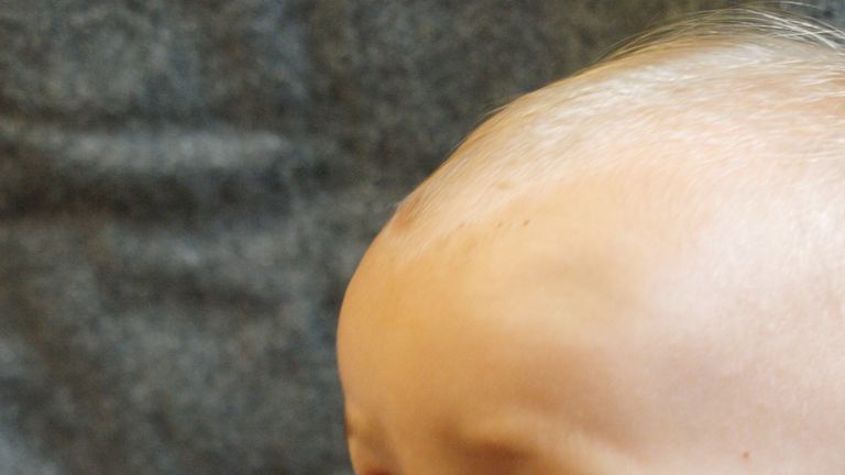 A modern day baby feeding from a reconstructed prehistoric bottle. Pic: Helena Seidl da Fonseca