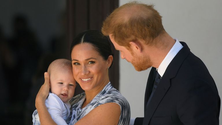 Prince Harry and Meghan, Duchess of Sussex, holding their son Archie, meet Archbishop Desmond Tutu 