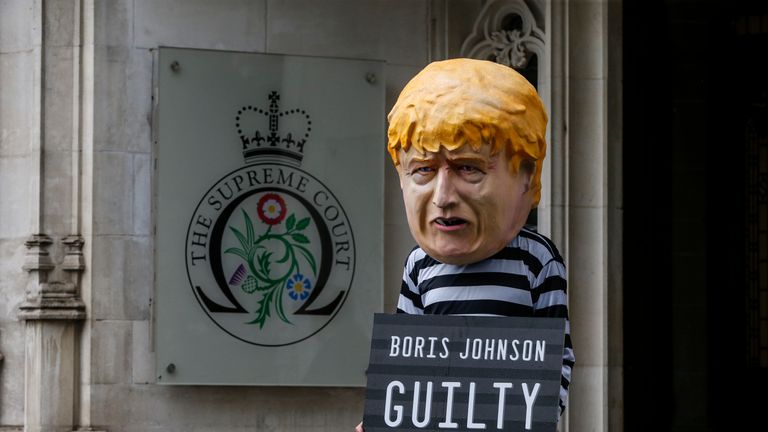  A protester dressed as Boris Johnson outside The Supreme Court 