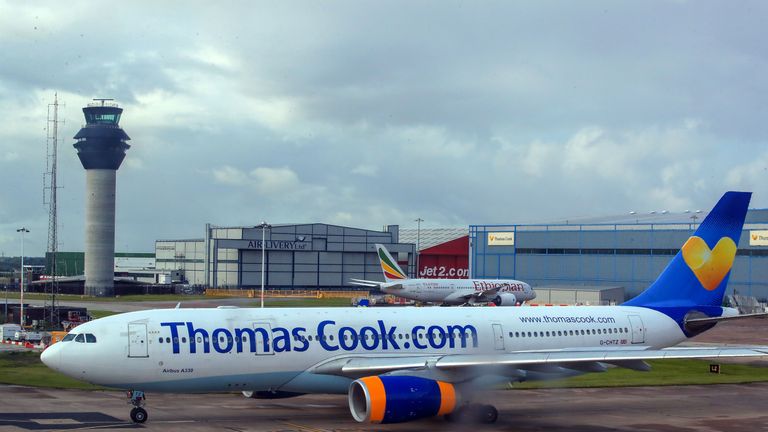 Thomas Cook and Ethiopian Airlines planes on the runway at terminal one Manchester Airport