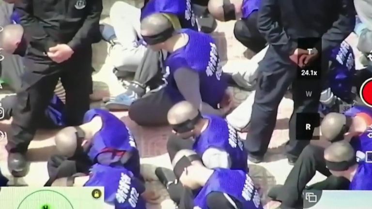 The footage appeared to show hundreds of blindfolded and shackled prisoners in a mostly-Muslim region of China