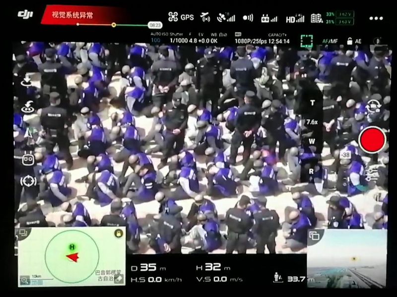 Video showing hundreds of shackled, blindfolded prisoners in China is  'genuine' | World News | Sky News