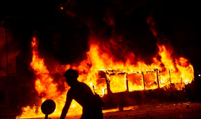 Army on streets after protesters set fire to Chile metro stations