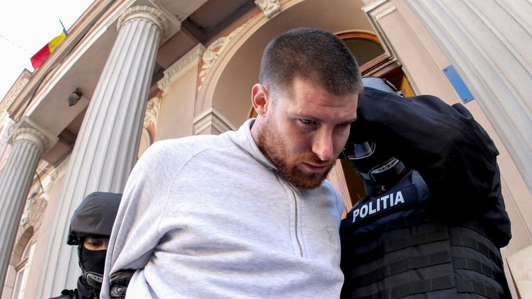 British citizen Shane O'Brien is escorted by police following his hearing in Cluj-Napoca, Romania, March 24, 2018. Picture taken March 24, 2019. Inquam Photos/Mihaela-Ionela Bobar via REUTERS ATTENTION EDITORS - THIS IMAGE WAS PROVIDED BY A THIRD PARTY. ROMANIA OUT. NO COMMERCIAL OR EDITORIAL SALES IN ROMANIA. NO COMMERCIAL OR EDITORIAL SALES IN ROMANIA