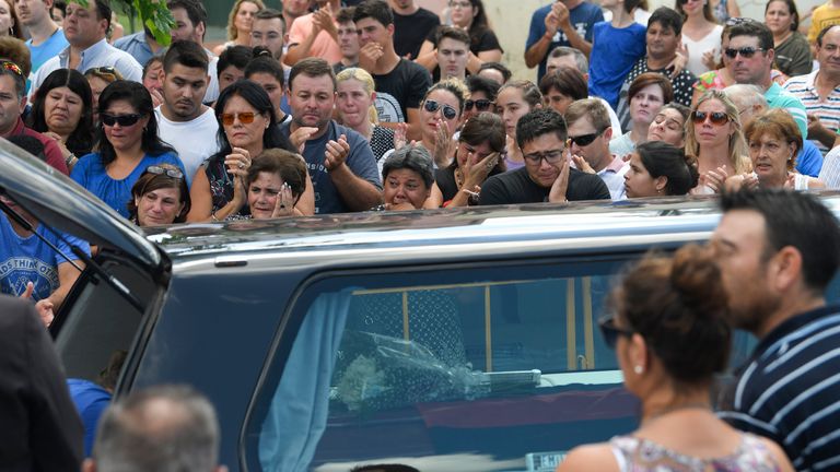 PROGRESO, ARGENTINA - FEBRUARY 16: Romina Sala (L), sister of Emiliano Sala kisses her late brother's coffin as it is being place in the hearse to take it to Santa Fe after a vigil at Sala's boyhood club San Martin de Progreso on February 16, 2019 in Progreso, Argentina. 28-year-old striker was killed when the private plane carrying him from Nantes to Cardiff crashed in the English Channel near Alderney on January 21. Sala's body was recovered from the wreckage on February 6 and pilot David Ibbotson remains missing. (Photo by Gustavo Garello/Getty Images)