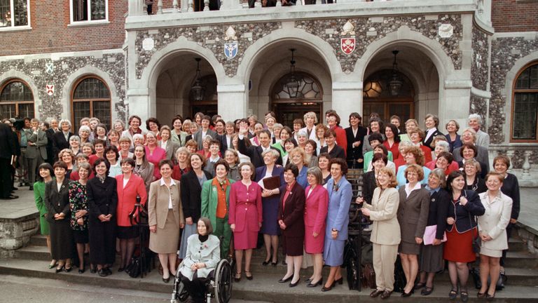 Prime Minister Tony Blair surrounded by his 101 women MPs outside Church House, at Westminster, London.