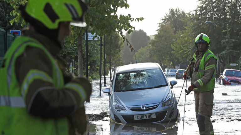 Firefighters on a flooded street in Finsbury Park, north London, after a pipe burst on Tuesday morning.