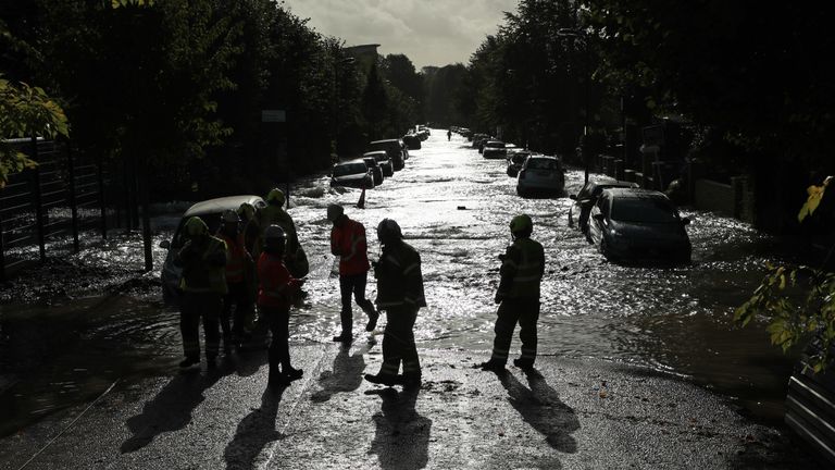 Firefighters on a flooded street in Finsbury Park, north London, after a pipe burst on Tuesday morning.