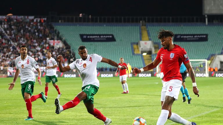 SOFIA, BULGARIA - OCTOBER 14: Tyrone Mings of England crosses under pressure from Georgi Pashov of Bulgaria during the UEFA Euro 2020 qualifier between Bulgaria and England on October 14, 2019 in Sofia, Bulgaria. (Photo by Catherine Ivill/Getty Images)