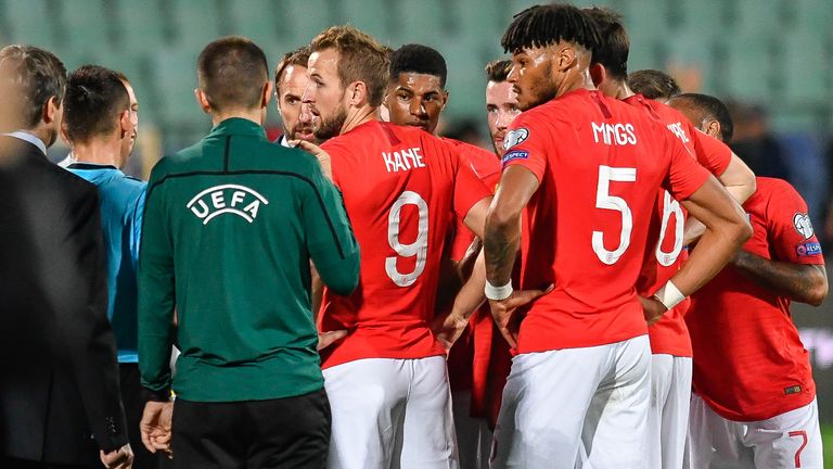 England's forward Harry Kane (C) speaks with the referees during a temporary interruption of the Euro 2020 Group A football qualification match between Bulgaria and England due to incidents with fans, at the Vasil Levski National Stadium in Sofia on October 14, 2019. (Photo by NIKOLAY DOYCHINOV / AFP) (Photo by NIKOLAY DOYCHINOV/AFP via Getty Images)