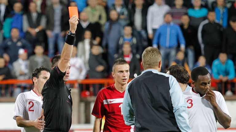 KRUSEVAC, SERBIA - OCTOBER 16: Referee Huseyin Gocek shows the red card to Danny Rose (R) of England after the Under 21 European Championship Play Off second leg match between Serbia U21 and England U21 at Stadium Mladost on October 16, 2012 in Krusevac, Serbia. (Photo by Srdjan Stevanovic/Getty Images)