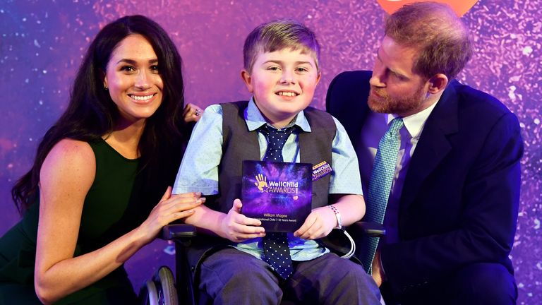The Duke and Duchess of Sussex pose for a photograph with award winner William Magee during the annual WellChild Awards at the Royal Lancaster Hotel, London.