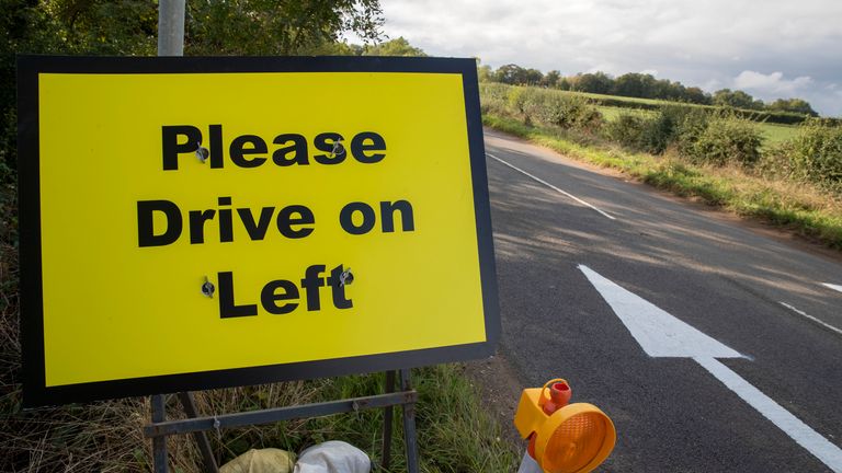 Please Drive on Left signs and arrows have been placed on the B4031 road outside RAF Croughton, in Northamptonshire, where Harry Dunn, 19, died when his motorbike was involved in a head-on collision in August.