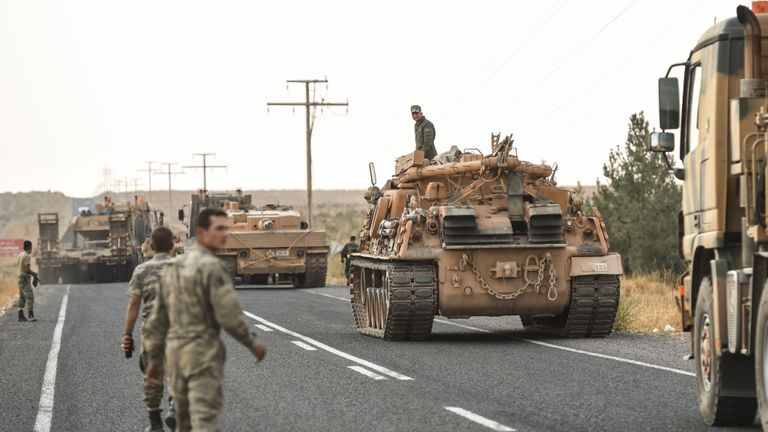 CEYLANPINAR, TURKEY - OCTOBER 18: A Turkish soldiers preparer the tanks as they secures the road before army tanks start moving towards the Syrian border on October 18, 2019 in Ceylanpinar, Turkey. Turkish forces appeared to continue shelling targets in Northern Syria despite yesterday's announcement, by U.S. Vice President Mike Pence, that Turkey had agreed to a ceasefire in its assault on Kurdish-held towns near its border. (Photo by Burak Kara/Getty Images)