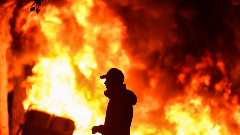 BARCELONA, SPAIN - OCTOBER 18: Fires burn following an evening of rioting as a general strike is called after a week of protests over the jail sentences given to separatist politicians by Spain’s Supreme Court, on October 18, 2019 in Barcelona, Spain. Nine Catalan pro-independence leaders were sentenced earlier this week to varying jail terms for sedition, in relation to the 2017 independence referendum. (Photo by Jeff J Mitchell/Getty Images)