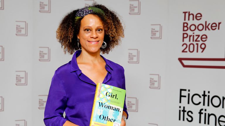 British author Bernardine Evaristo poses with her book Girl, Woman, Other during the photo call for the authors shortlisted for the 2019 Booker Prize for Fiction at Southbank Centre in London on October 13, 2019