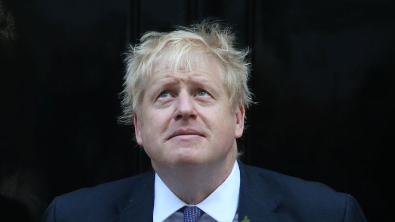 Britain&#39;s Prime Minister Boris Johnson looks up as he meets with fundraisers for the Royal British Legion outside 10 Downing street in central London on October 28, 2019. - European Union members agreed today to postpone Brexit for up to three months, stepping in with their decision less than 90 hours before Britain was due to crash out with no divorce deal. (Photo by ISABEL INFANTES / AFP) (Photo by ISABEL INFANTES/AFP via Getty Images)