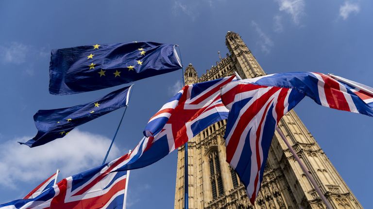 TOPSHOT - Union and EU fags flutter outside the Houses of Parliament in Westminster, London on March 28, 2019. - Faced with losing all control over the Brexit process, British Prime Minister Theresa May looks to have played her final card by announcing she will step down if MPs approve her Brexit deal. (Photo by Niklas HALLE&#39;N / AFP)        (Photo credit should read NIKLAS HALLE&#39;N/AFP/Getty Images)