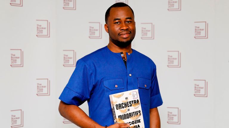 Nigerian author Chigozie Obioma poses with his book An Orchestra of Minorities during the photo call for the authors shortlisted for the 2019 Booker Prize for Fiction