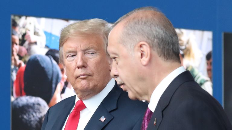 US President Donald Trump (L) talks to Turkeys President Recep Tayyip Erdogan (R) as they arrive for the NATO (North Atlantic Treaty Organization) summit, at the NATO headquarters in Brussels, on July 11, 2018. (Photo by Tatyana ZENKOVICH / POOL / AFP) (Photo credit should read TATYANA ZENKOVICH/AFP/Getty Images)