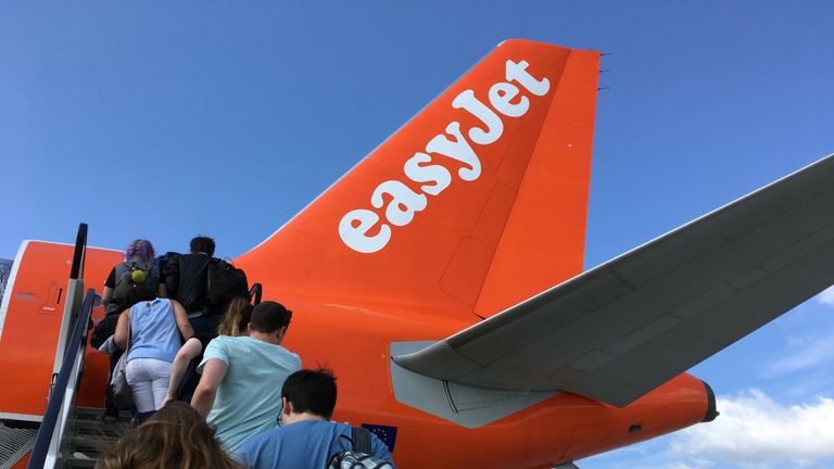 Passengers board an EasyJet flight at Gatwick