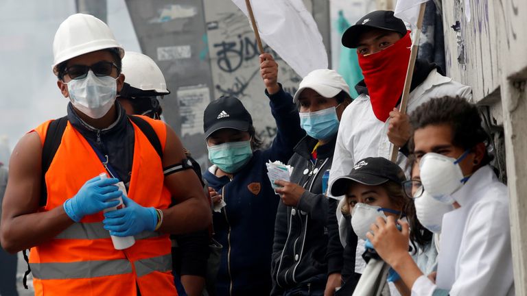 Demonstrators were seen wearing protective masks and hats