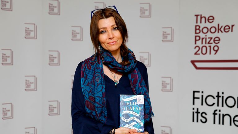 Turkish-British author Elif Shafak poses with her book 10 Minutes 38 Seconds in This Strange World during the photo call for the authors shortlisted for the 2019 Booker Prize for Fiction