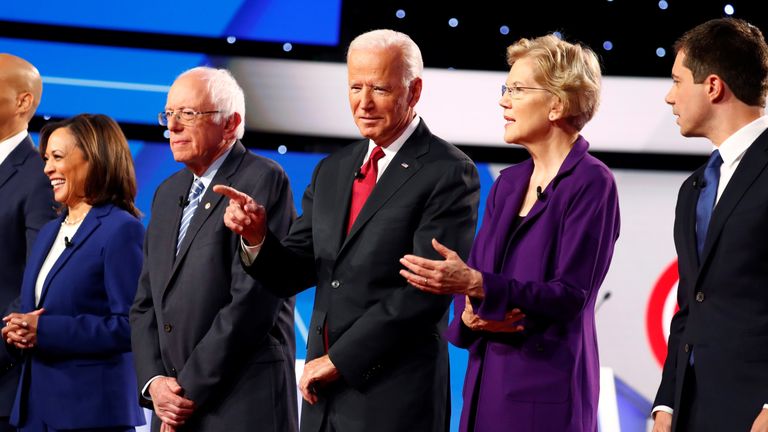 Senator Kamala Harris, Senator Bernie Sanders, former Vice President Joe Biden, Senator Elizabeth Warren and South Bend Mayor Pete Buttigieg wait onstage before the fourth Democratic U.S. 2020 presidential election debate in Westerville, Ohio Tuesday