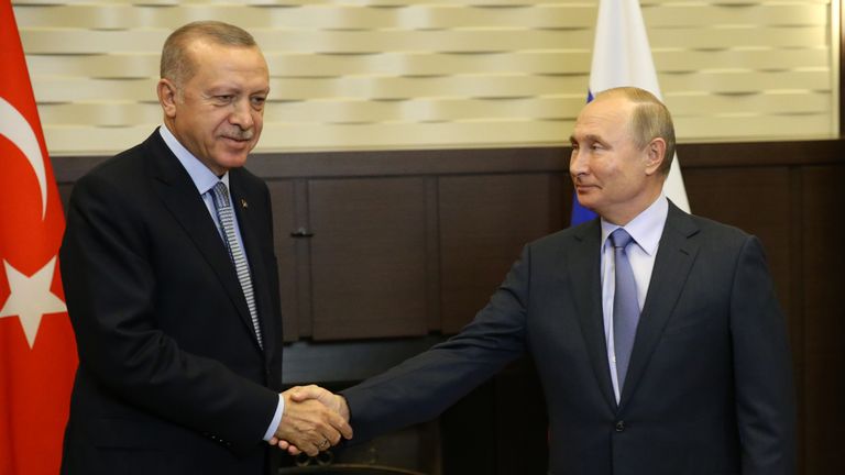 Turkish President Recep Tayyip Erdogan shakes hands with Russian leader Vladimir Putin at the end of the meeting